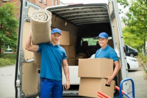 happy movers unloading a van